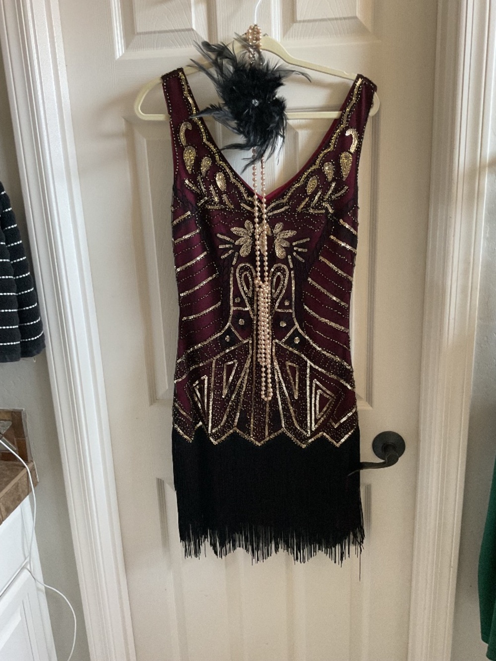 Flapper dress with fascinator  headpiece and long pearl necklace